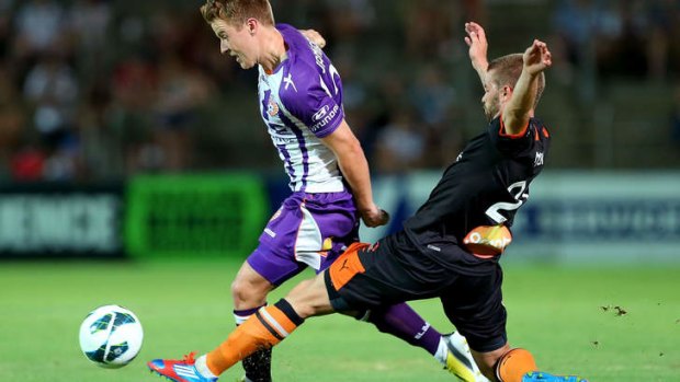 James Meyer of the Brisbane Roar tackles Scott Jamieson of Perth Glory during their round 18 A-League match at nib Stadium.