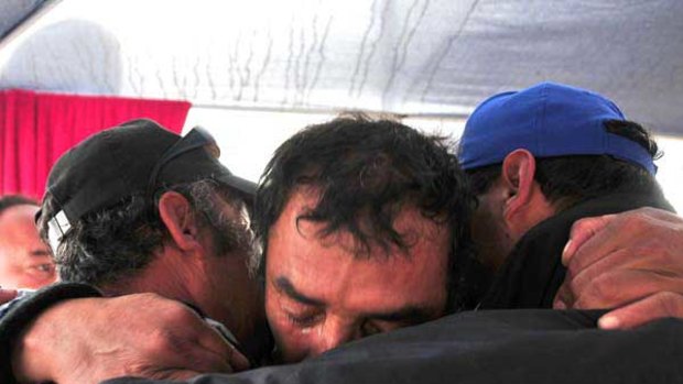 Relatives of the trapped miners cried and celebrated after the drill reached their shelter in the San Jose mine.