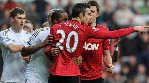 Angry ... Robin van Persie reacts after clashing with Swansea's Ashley Williams.