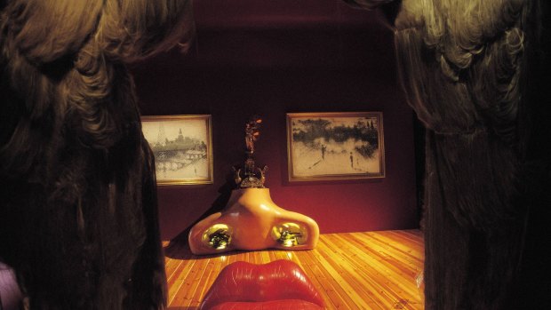 Immortalised: A ruby-red sofa and a pair of paintings help form a 3D image of the actress's face in the Mae West Room at the Dali Theatre-Museum in Figueres.