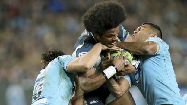 Hard yakka: Nick Phipps and Kurtley Beale try to bring down Henry Speight.