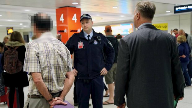  Former St Mary's Cathedral College principal David Standen is arrested at Sydney Airport.