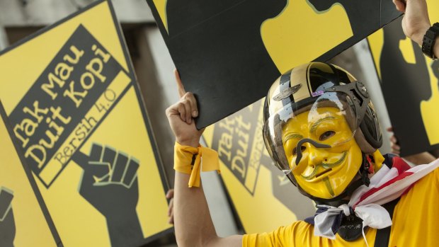 A masked anti-government protester in Kuala Lumpur in August last year.