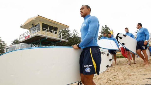On board: Will Hopoate leads Eels players for a surf at Cronulla.