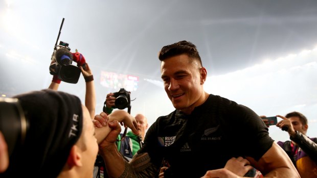 Magic moment: Sonny Bill Williams gives his World Cup winning medal to young fan Charlie Lines.