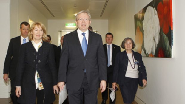 Kevin Rudd leads his supporters into today's Labor caucus meeting.