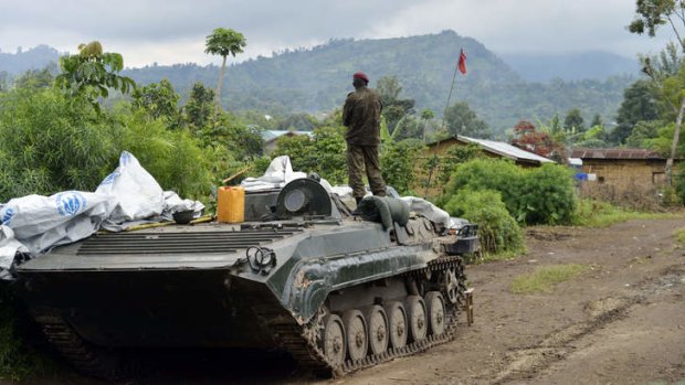 Rebellion over: A Democratic Republic of Congo FARDC regular army soldier looks out at the Mbuzi hilltop in Rutshuru after the army recaptured the area from M23 rebels.