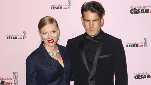 Scarlett Johansson and  Romain Dauriac arrive for the 39th Cesar Film Awards 2014 at Theatre du Chatelet on February 28, 2014 in Paris, France.