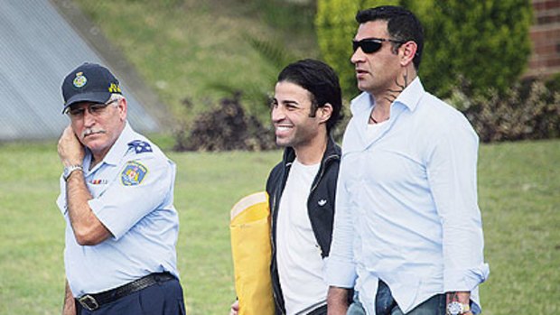 Released...a smiling Fadi Ibrahim leaves Long Bay jail yesterday with his brother Sam and a corrective services guard