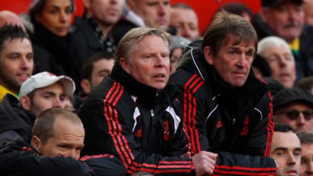 Kenny Dalglish (right) and assistant Sammy Lee look on.