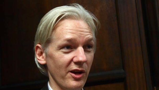 Julian Assange . . . said he was warned of "dirty tricks".