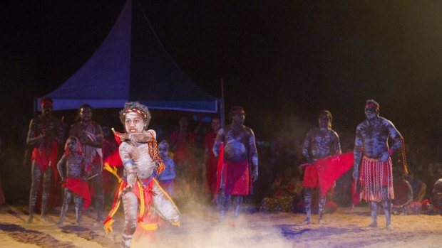 A boy performs with the Red Flag Dancers, a group from the Arnhem Land community of Numbulwarr.