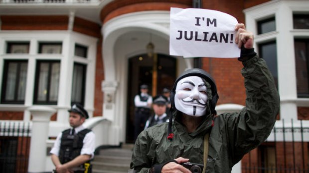 A supporter of Julian Assange stands outside the Ecuadorian embassy in London, where the WikiLeaks founder was granted asylum.