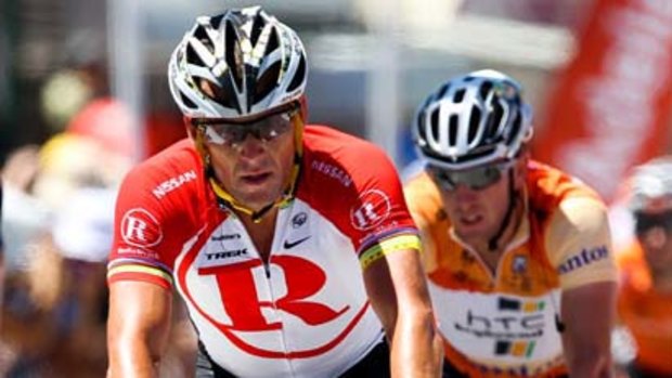 Lance Armstrong crosses the finish line ahead of Matt Goss during stage two of the 2011 Tour Down Under.