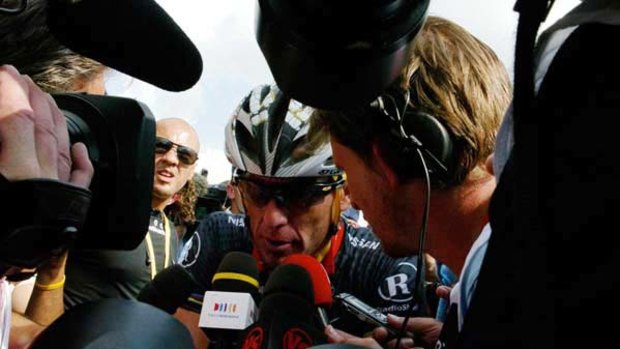 Lance Armstrong faces the media after crashing out of contention on stage eight.