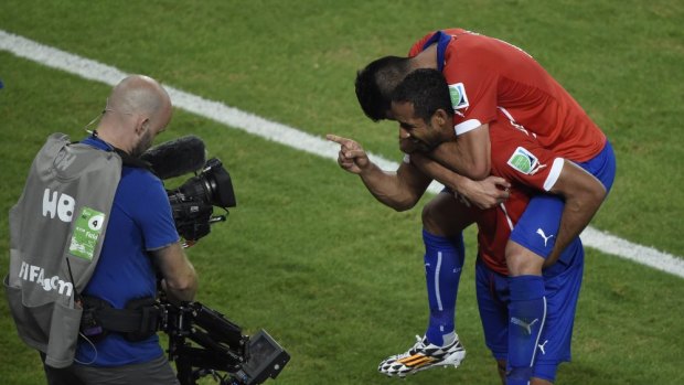 Chile's midfielder Jean Beausejour  celebrates after scoring his team's third goal against Australia.   