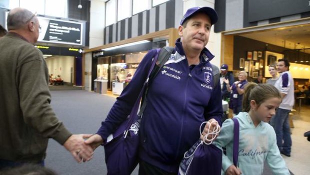 A friendly hand: Fremantle coach Ross Lyon at Melbourne airport before heading home to West Australia.