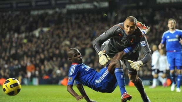 Tottenham goalkeeper Heurelho Gomes fouls Chelsea's Ramirez inside the six-yard box.
