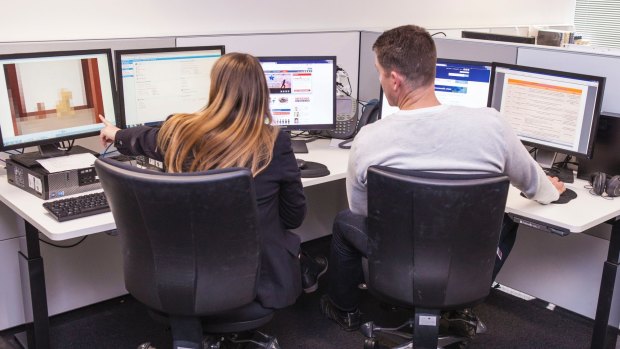 Officers in the Australian Federal Police Child Exploitation Assessment Centre in Canberra where they go through images of child exploitation to apprehend offenders and identify and rescue victims.