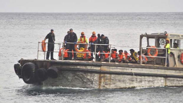 Rescued: A barge carrying suspected asylum seekers nears Christmas Island on June 22, 2012.