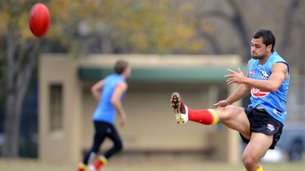 Karmichael Hunt trains with Gold Coast at Wesley College in Melbourne yesterday. His contract, and that of Israel Folau, is causing angst among the game's established players.