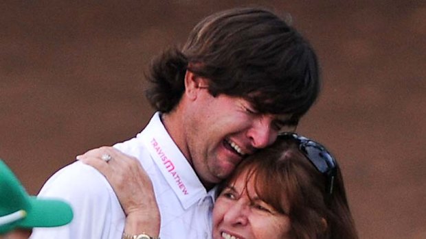 First major ... Bubba Watson sheds a tear as he celebrates with his mother Molly.