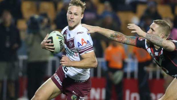 Bursting clear of the pack: Daly Cherry-Evans scores for Manly against the Warriors on Sunday.