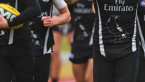 The Magpies have questioned the validity of a report that 11 players recorded positive tests.
