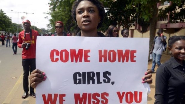 A woman carries placard to press for the release of missing Chibok school girls during a rally by civil society in Lagos on Sunday.