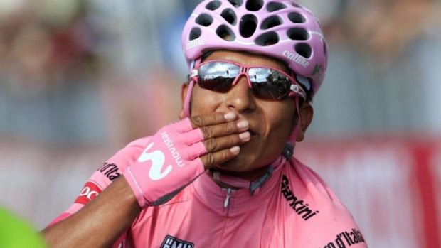 Nairo Quintana celebrates as he becomes the first Colombian to win one of cycling's three grand tours.