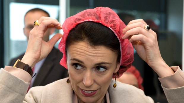 New Zealand Labour Party leader Jacinda Ardern puts on a hair net as she prepares to enter a mushroom factory in Christchurch, New Zealand.