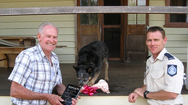Jim Touzeau with his dog Teka and RSPCA Queensland's Bundaberg Inspector Patrick Yeates.