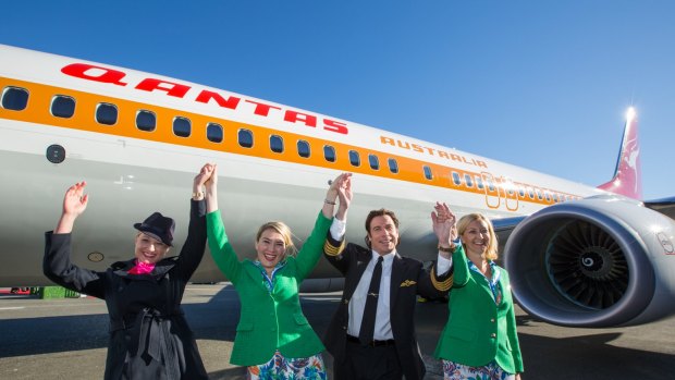 "I don't know whether to do an Aboriginal dance or a disco dance.": Qantas ambassador John Travolta was on hand to launch the plane. 