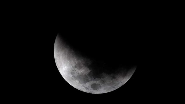 The moon is eclipsed over Sydney.