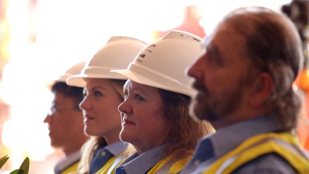 From right: Roy Hill CEO Barry Fitzgerald; Gina Reinhart; and  daughter Ginia at the ceremony noting the first shipment of iron ore from Roy Hill Mine at the port facilities at Port Hedland, WA. 