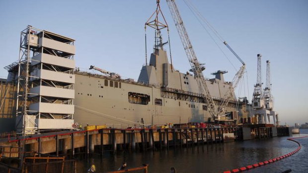CAPITAL AFLOAT: HMAS Canberra is almost 28,000 tonnes. The combined cost of Canberra and its sister ship, Adelaide, will be more than $3.1 billion.