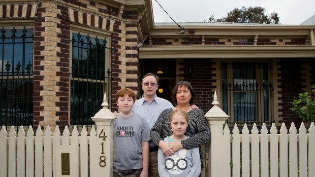 Howard and Gillian Tuxworth, with children Harry and Molly. Their Collingwood home is set to be levelled for a temporary road for East West Link construction vehicles.