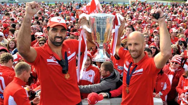 Swans present the Grand Final cup to their fans at Lakeside Stadium.