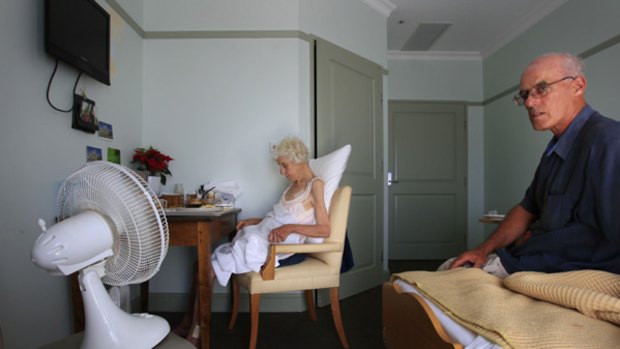 Michael Sabey sits with his mother Catherine, 92, in her room at Regis Bayside Gardens.