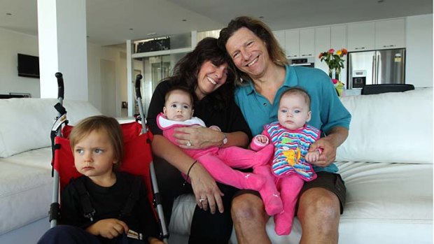 In good spirits: Jerry Schwartz at home in Vaucluse with his wife and business partner Debbie, six-month-old twins Amber, on Debbie's lap, and Lara, and son Dane, aged 3.