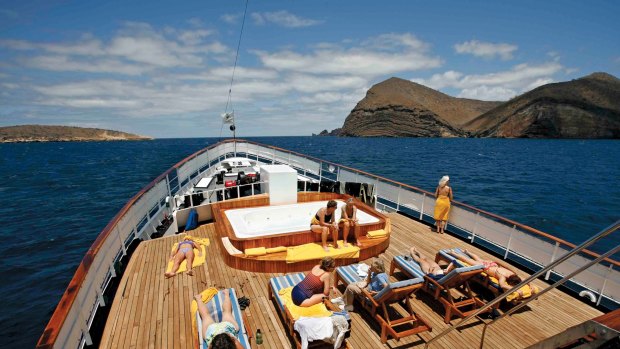 Enjoying the sun on the deck of Quark Expeditions ship Evolution in the Galapagos.