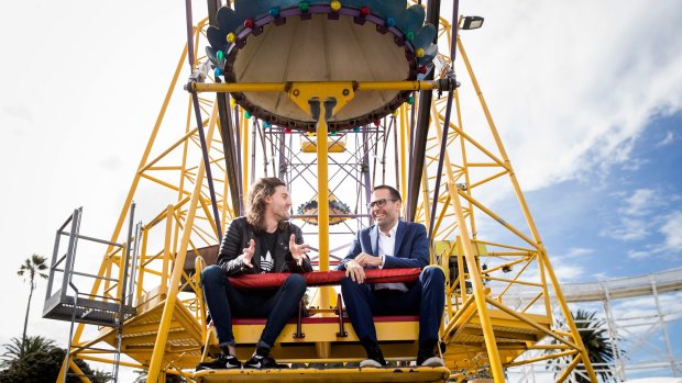 C2 chief operating officer Martin Enault, right, with media host Dan Debuf, says business couples should give their "date" three turns of the Ferris wheel.