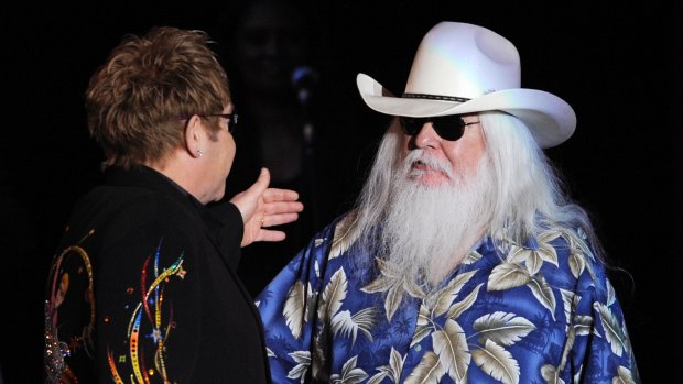 Elton John greets Leon Russell  during their joint concert at the Hollywood Palladium in 2010. 