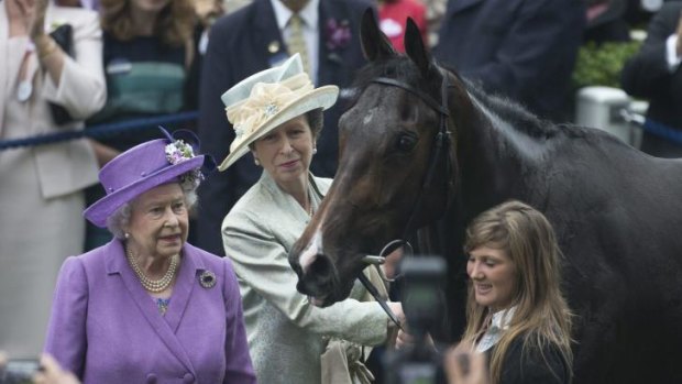 Britain's Queen Elizabeth II, with her daughter Princess Anne and her horse Estimate, who won the 2013 Ascot Gold Cup.