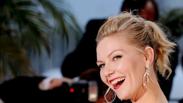 Best actress ... Kirsten Dunst shows off her award at Cannes.