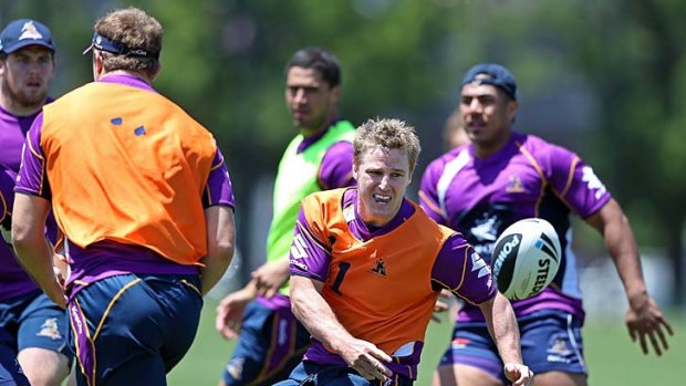 Brett Finch passes during a Melbourne Storm NRL training session at Gosch's Paddock on Monday.
