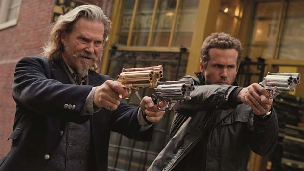 Brothers in arms: Ryan Reynolds (right) with Jeff Bridges take on dead villains in <i>R.I.P.D.</i>