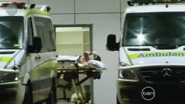 A Ten News screengrab of Todd Bairstow arriving at hospital last night after fighting off a 4-metre crocodile.