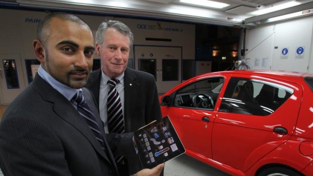 Vikash Rugoobur and Dr Laurie Sparke, with the EDay electric car and the iPad controller.