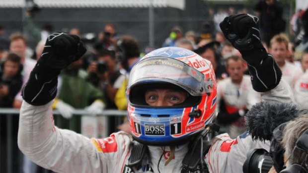 Jenson Button celebrates an unlikely victory in a rain-marred Canadian Grand Prix.